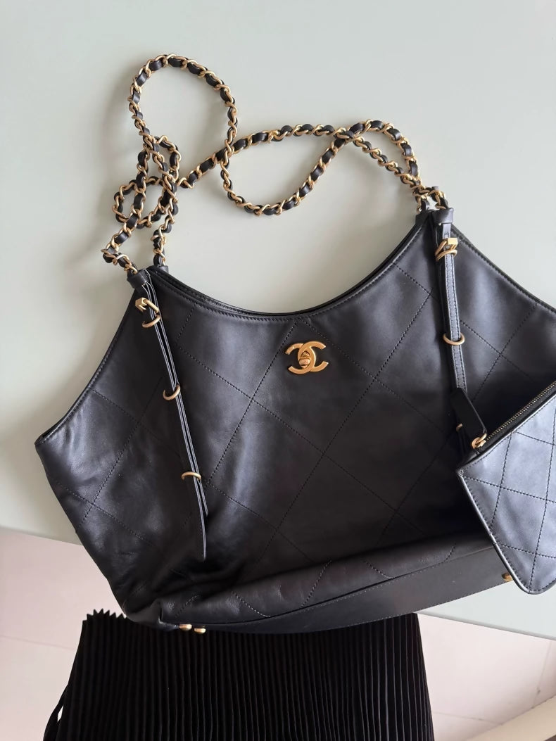 Large black and gold Chanel 25 hobo bag