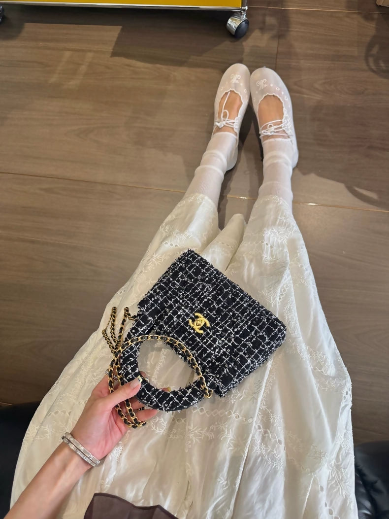 Chanel 24P Kelly Nano bag in black and white tweed