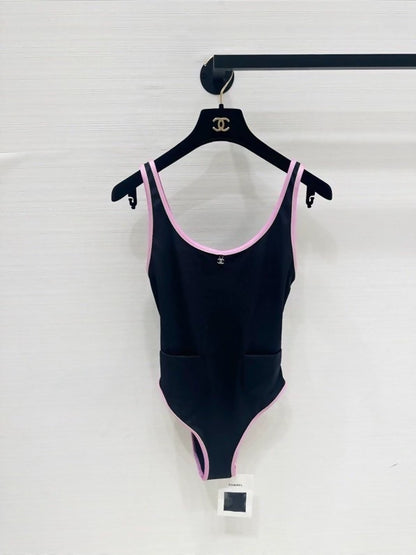 Chanel 25m Coco Beach collection pink-trimmed swimsuit