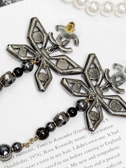 Chanel Métiers d'Art silver butterfly long stud earrings