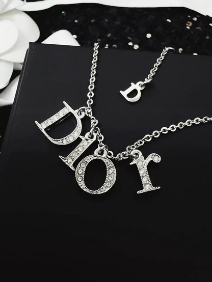 Dior bracelet with a letter pendant fully set with diamonds