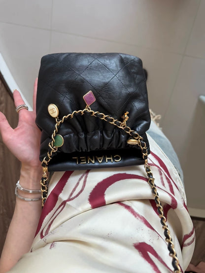 Chanel 23P black leather bag with Charms