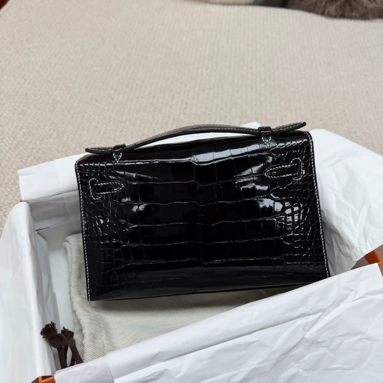 Hermes Kelly pochette black shiny crocodile leather palladium hardware