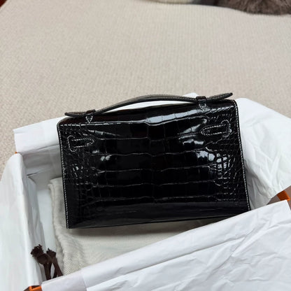 Hermes Kelly pochette black shiny crocodile leather palladium hardware