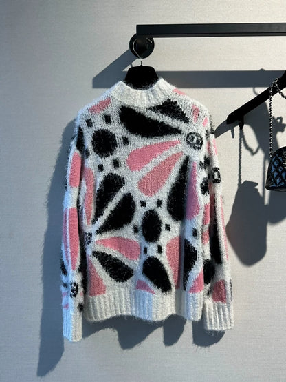 Chanel 23k runway pink, white, and black color-blocked floral sweater,