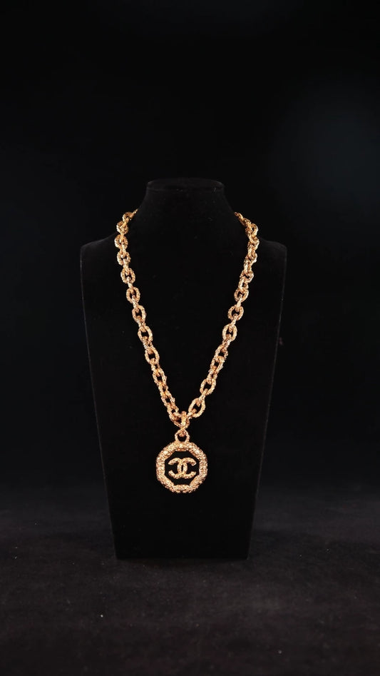 Chanel necklace, 2003, gold-plated, pendant in sculpted lava, CC motif.