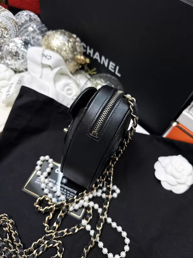Chanel 22S black and gold quilted heart-shaped crossbody bag