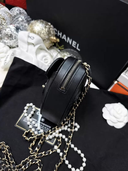 Chanel 22S black and gold quilted heart-shaped crossbody bag