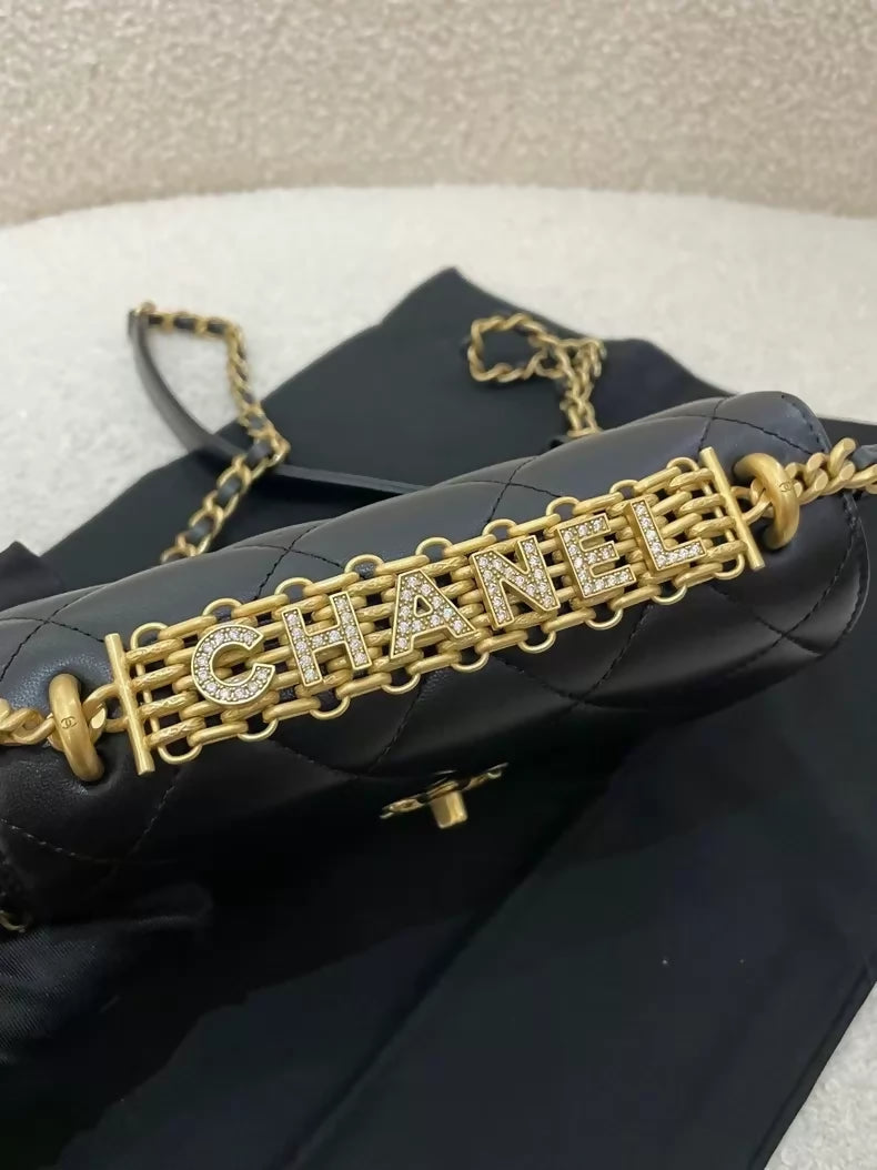 Chanel black and gold lettering rhinestone shoulder bag