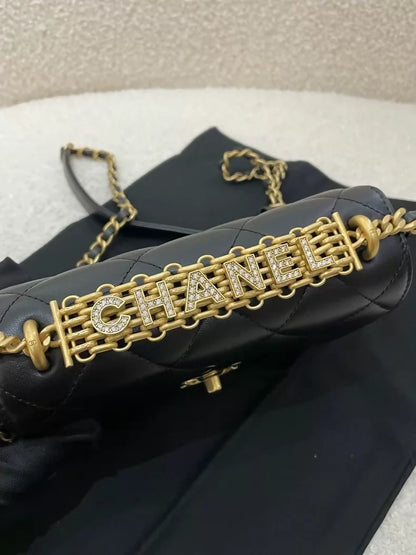 Chanel black and gold lettering rhinestone shoulder bag