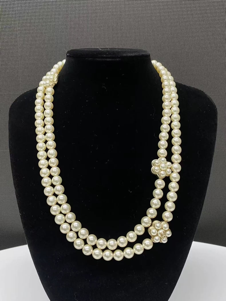 Chanel's multi-layered pearl floral design exudes elegance and sophistication