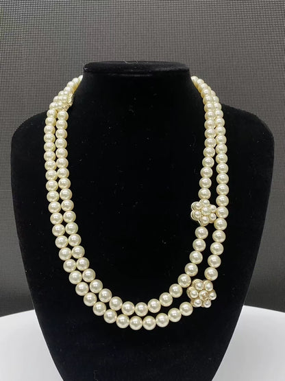 Chanel's multi-layered pearl floral design exudes elegance and sophistication