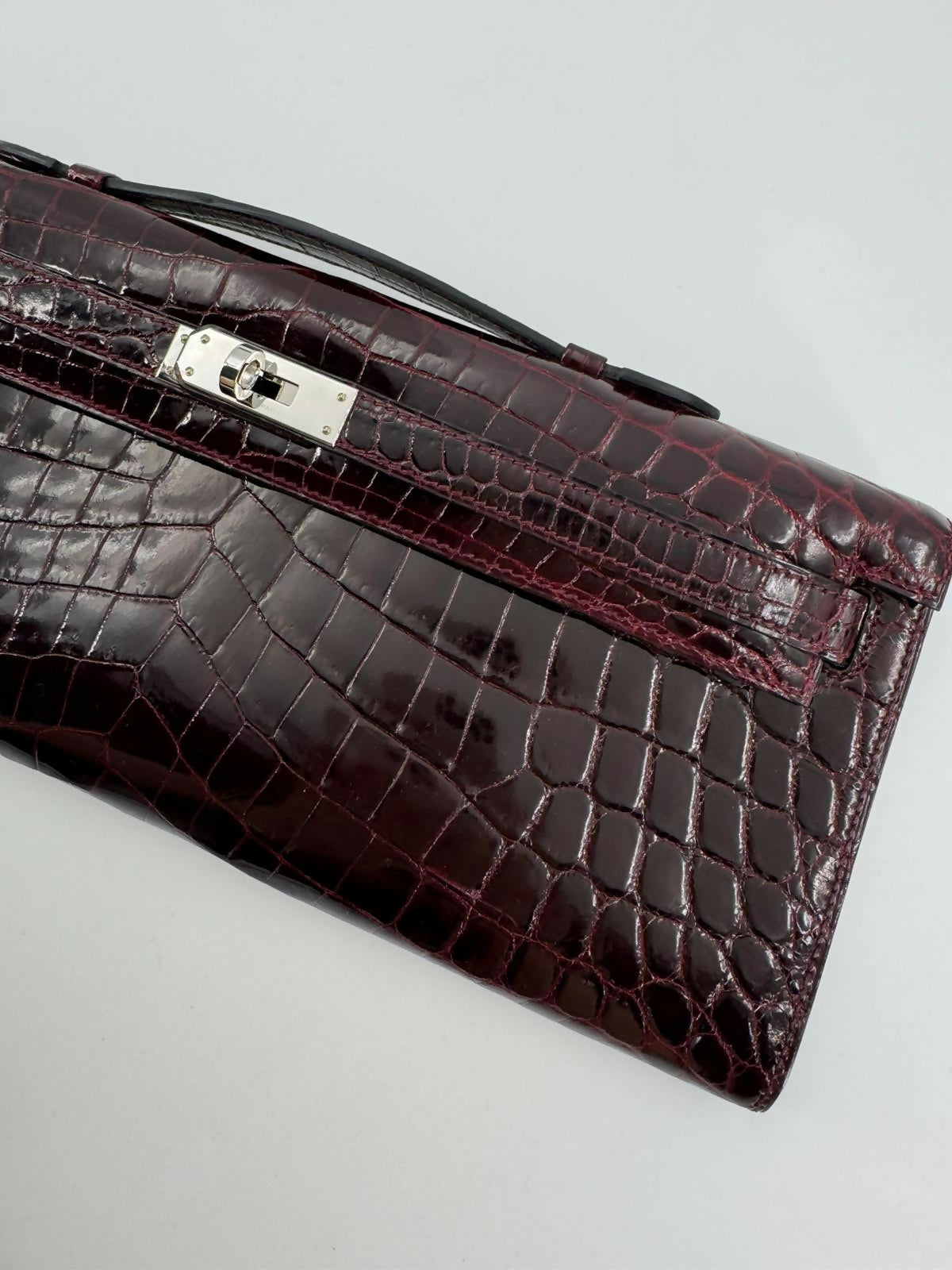 Hermès Kelly Cut Bag in Bordeaux Shiny Porosus Crocodile Leather with PHW