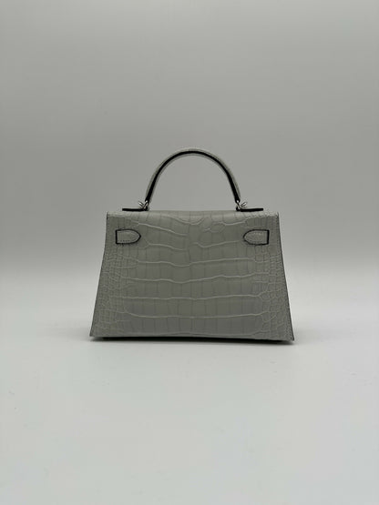 Hermès Kelly 20 Gris Neve Matte Alligator PHW K 2026