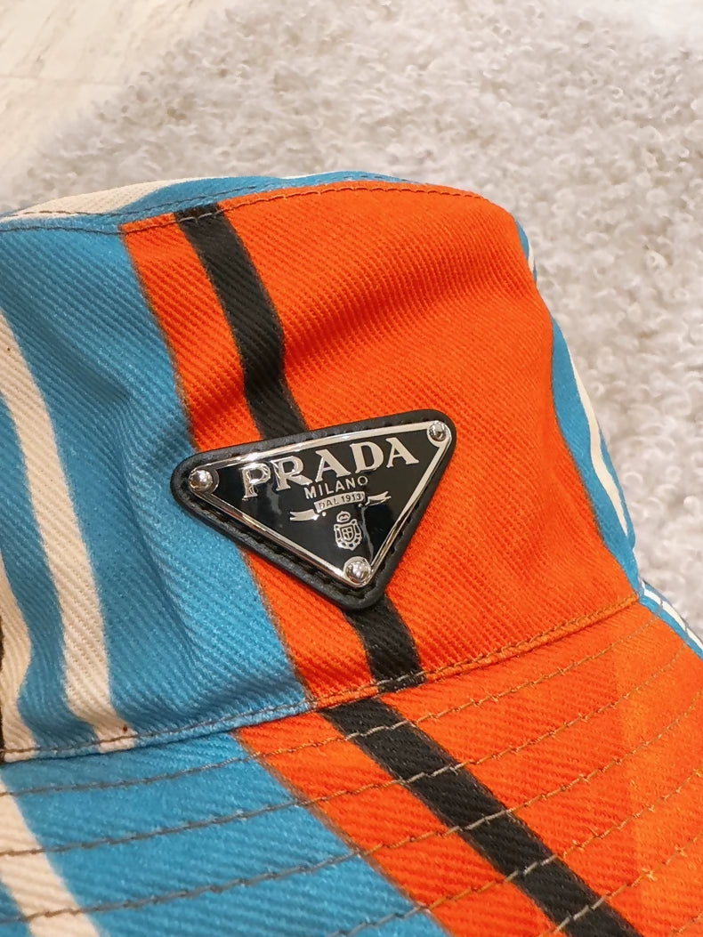 PRADA triangular metal logo colorful bucket hat