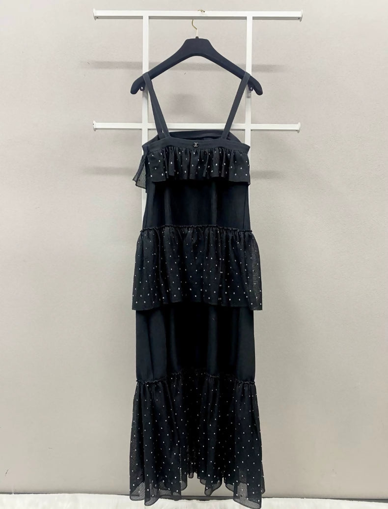 chanel black cocktail dress Happy Birthday to iconic French fashion designer, Coco Chanel She revolutionized the way women dressed with her 'Little Black Dress', a practical yet timeless look Wearing a silk pliss strapless cocktail dress