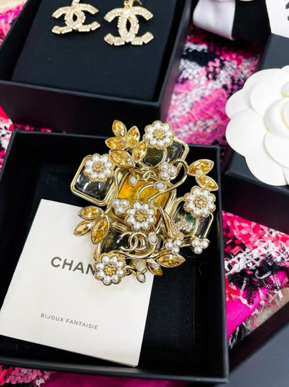 Chanel 22 flower cross brooch