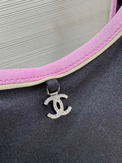 Chanel 25m Coco Beach collection pink-trimmed swimsuit