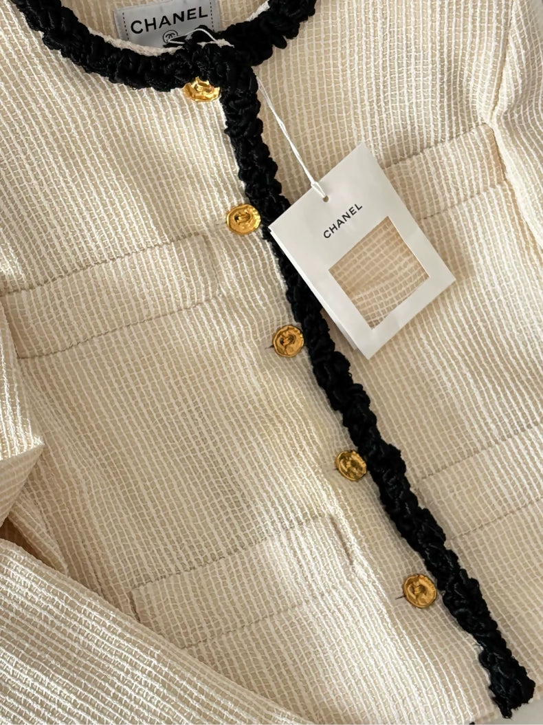 Chanel 26S ecru tweed jacket with black piping