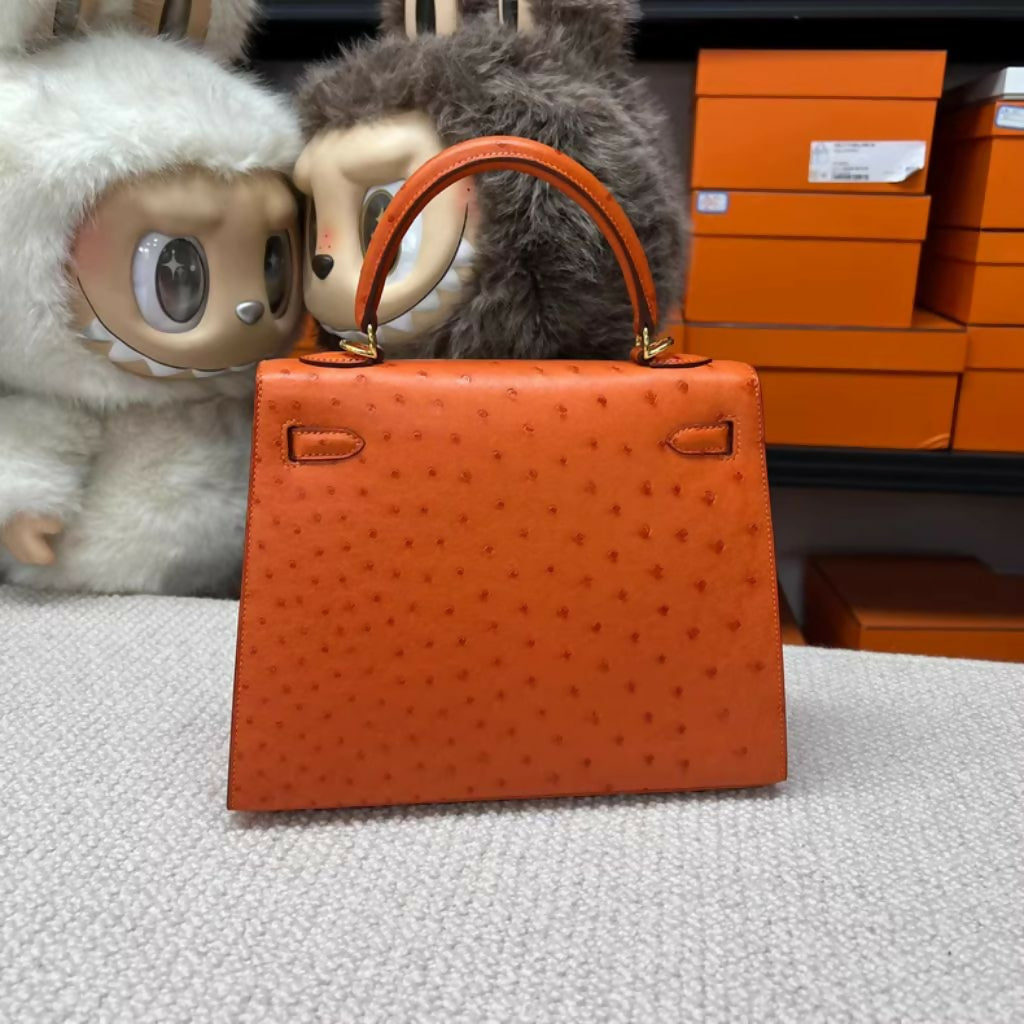 Hermès Kelly 25 Tangerine Orange Ostrich Leather with Gold