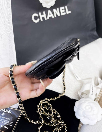 Chanel black camellia round chain bag