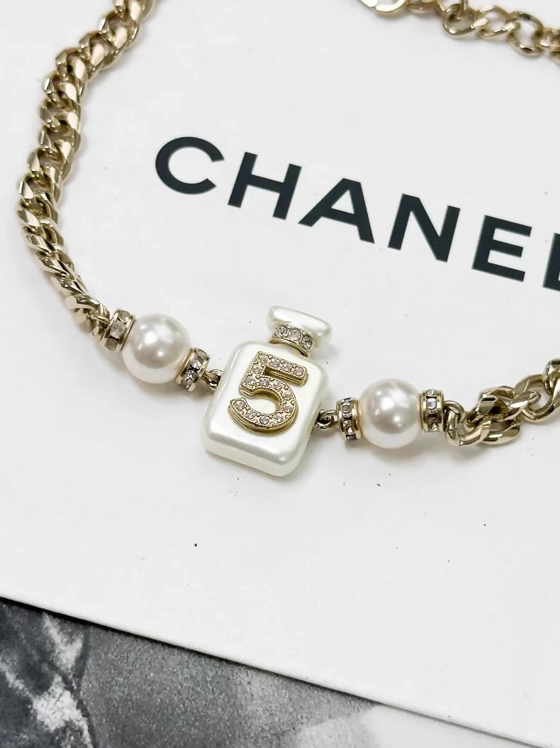 Chanel Spring/Summer 2022 Collection No. 5 white perfume bottle choker necklace