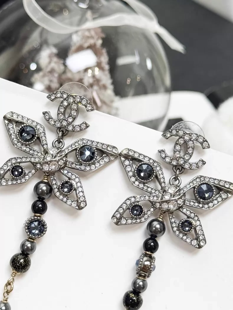 Chanel Métiers d'Art silver butterfly long stud earrings