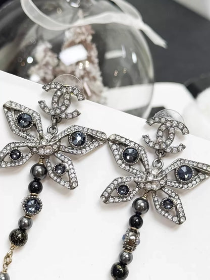 Chanel Métiers d'Art silver butterfly long stud earrings