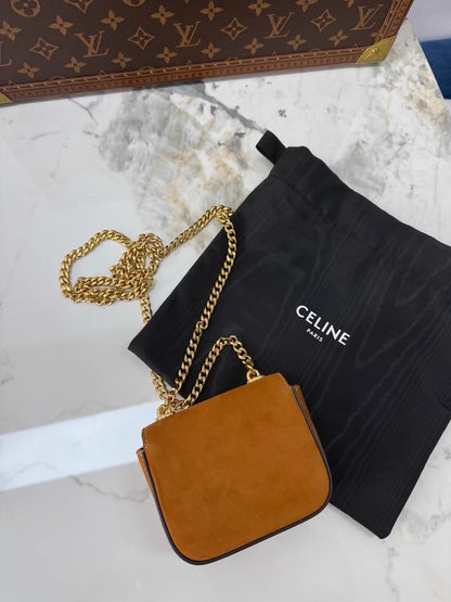 Celine
s new gold mini calfskin chain crossbody/shoulder bag with gold hardware.