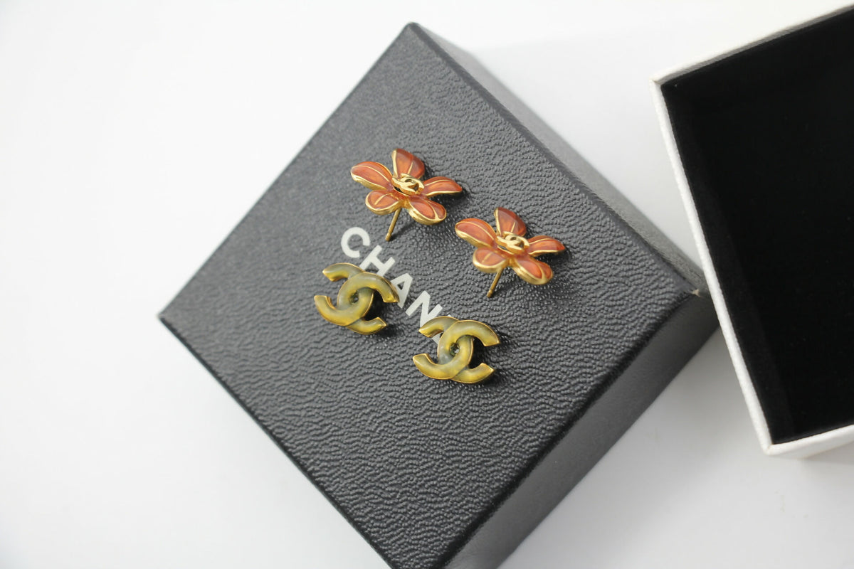 Chanel 03P Enamel Orange Five-Petal Flower Green CC Stacked Earrings