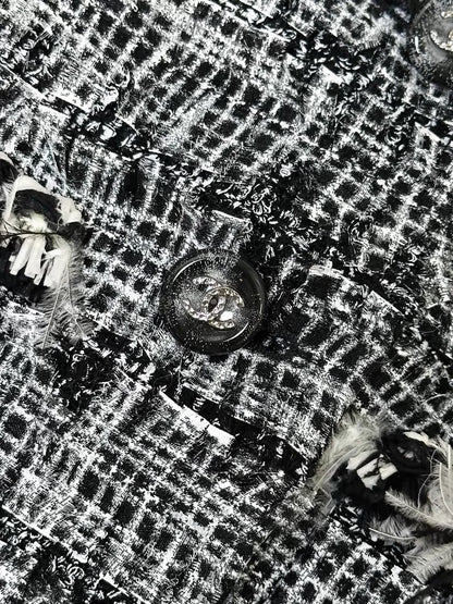 Chanel Spring/Summer 2011 black and white tweed jacket.