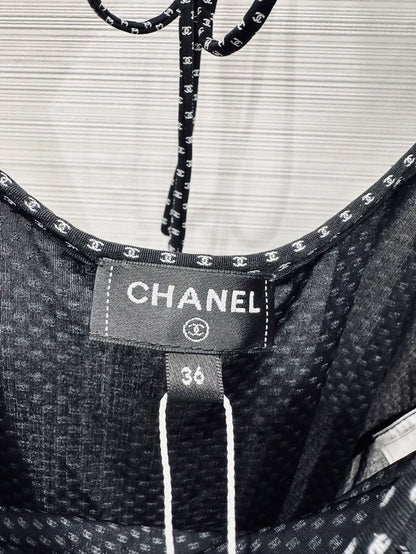 Chanel 24b top with ruffles and double C logo