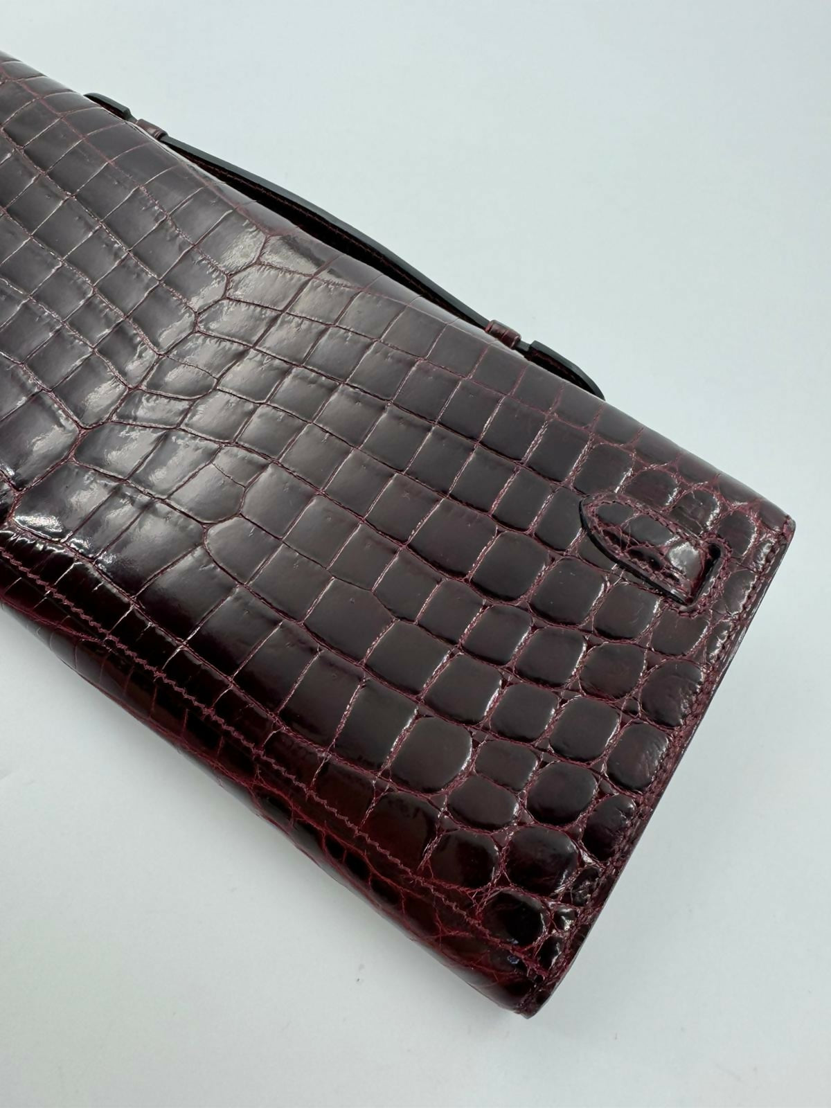 Hermès Kelly Cut Bag in Bordeaux Shiny Porosus Crocodile Leather with PHW