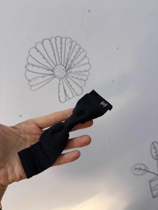 Chanel's classic black bow double-C hair clip