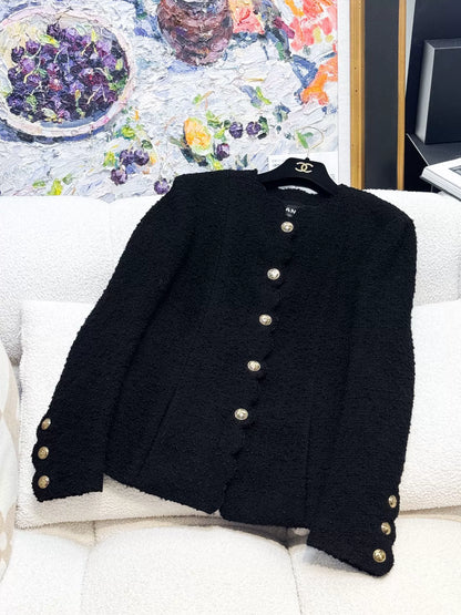 Chanel 20k black tweed jacket