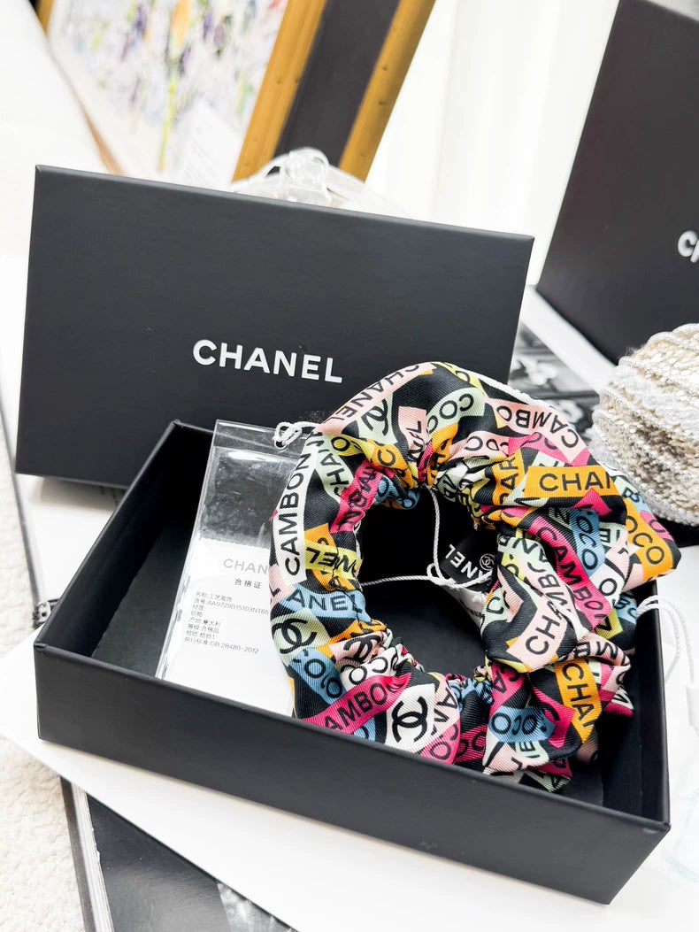 Chanel 24C hair tie with colorful all-over logo print