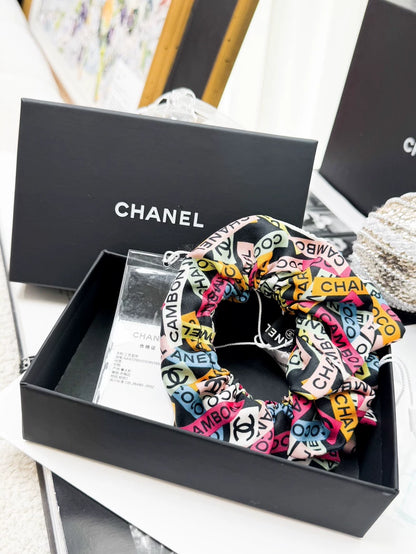 Chanel 24C hair tie with colorful all-over logo print