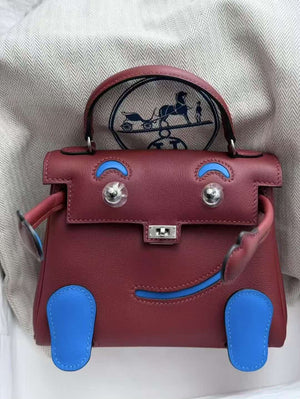 Hermes Kelly doll rouge H / Zanzibar palladium hardware