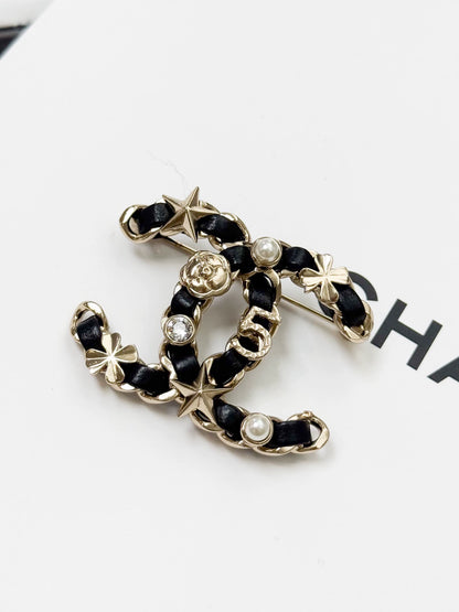 Chanel 20B Double C leather-threaded chain brooch