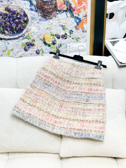 Chanel 17K mauve-pink mixed-color tweed jacket + skirt.
