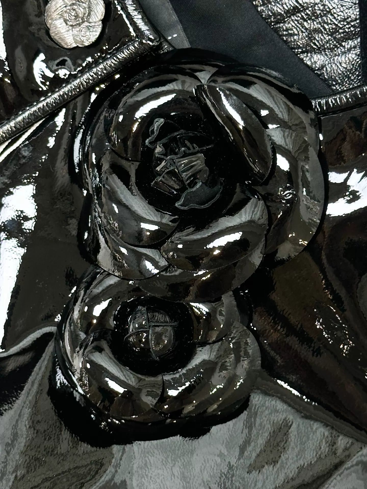 Chanel 23K black leather camellia jacket