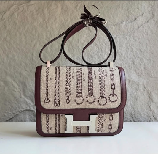 Hermès Constance shoulder bag with chain-print natural canvas flap, burgundy leather trim and silver-tone H clasp