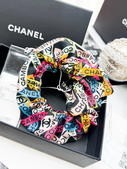 Chanel 24C hair tie with colorful all-over logo print