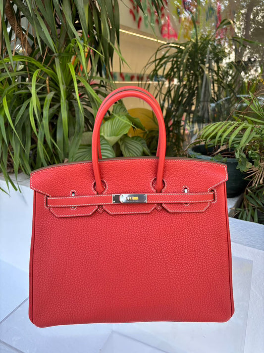 Red Hermès Birkin handbag in grained leather with palladium hardware, white contrast stitching and two rolled top handles
