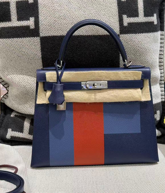 Kelly Sellier handbag in navy leather with blue and orange colour-block panels, palladium hardware and top handle
