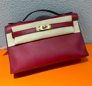 Hermes Kelly pochette rouge grenat swift gold hardware
