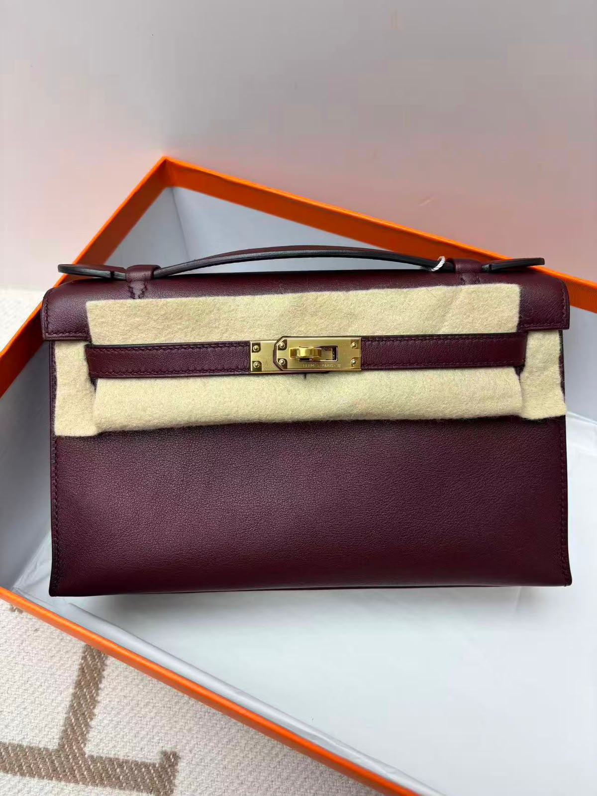 Hermes Kelly pochette Bordeaux Swift Gold hardware