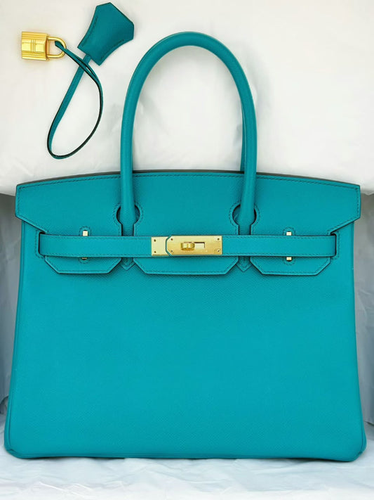 Birkin handbag in turquoise grained leather with gold-tone turn lock, rolled handles and clochette