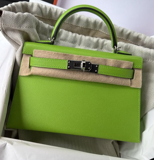 Hermès Kelly mini handbag in bright apple green with palladium hardware and single top handle