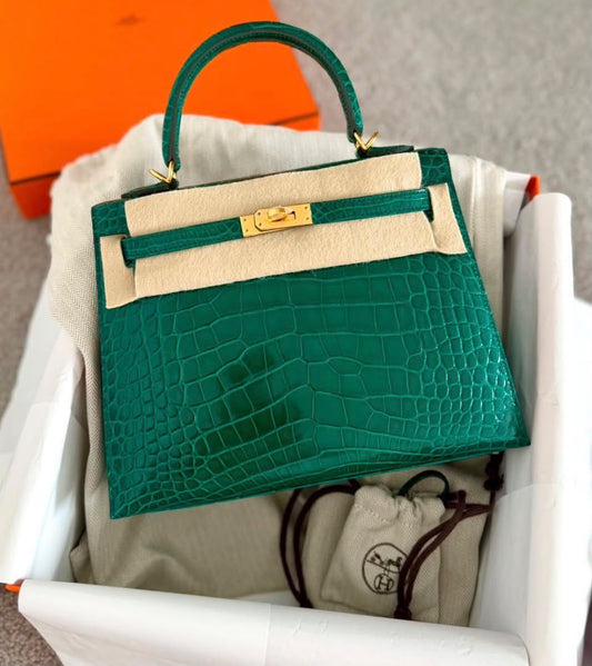 Hermès Kelly Sellier handbag in emerald green crocodile leather with gold-tone hardware and single top handle
